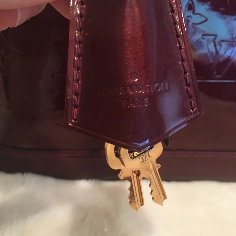 Louis Vuitton Alma pm rouge fauviste. Excellent